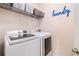 Laundry room with shelving, washer, and dryer at 179 Waterstone Pt, Acworth, GA 30101