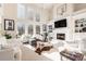 Spacious living room with fireplace and large windows at 179 Waterstone Pt, Acworth, GA 30101