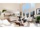 Living room with high ceilings, fireplace, and kitchen view at 179 Waterstone Pt, Acworth, GA 30101