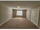Large bedroom with neutral walls and carpeting at 3974 Stillwater Dr, Duluth, GA 30096