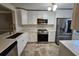 Updated kitchen with white cabinets and new appliances at 3974 Stillwater Dr, Duluth, GA 30096