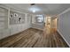 Open living room with hardwood floors and built-in shelving at 3974 Stillwater Dr, Duluth, GA 30096