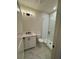 Modern bathroom with white vanity, marble floor, and glass shower at 500 Chiswick Cir # 11, Alpharetta, GA 30009