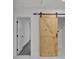 Stylish interior barn door with track hardware, providing a rustic and modern aesthetic at 2358 Tilson Rd, Decatur, GA 30032