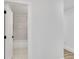 View of a clean, all-white bathroom with marble tile through a doorway at 2358 Tilson Rd, Decatur, GA 30032