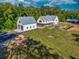 Sprawling property featuring a modern farmhouse, garage, and expansive lawn at 2731 Tribble Mill Rd, Lawrenceville, GA 30045