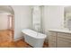 Bathroom with freestanding tub and modern vanity at 2731 Tribble Mill Rd, Lawrenceville, GA 30045