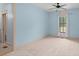 Charming bedroom with light blue walls and a window at 2731 Tribble Mill Rd, Lawrenceville, GA 30045