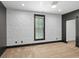 Bedroom with decorative wallpaper, neutral carpet, and modern window at 2731 Tribble Mill Rd, Lawrenceville, GA 30045