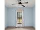 Bright bedroom featuring a large window and ceiling fan at 2731 Tribble Mill Rd, Lawrenceville, GA 30045