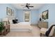 Calm bedroom featuring a plush bed, soft blue walls, and a window offering natural light at 2731 Tribble Mill Rd, Lawrenceville, GA 30045