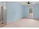 Cozy bedroom with carpet, natural light, showing a view of the outdoors through a large window at 2731 Tribble Mill Rd, Lawrenceville, GA 30045