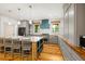 Modern kitchen with gray cabinets, hardwood floors and island at 2731 Tribble Mill Rd, Lawrenceville, GA 30045