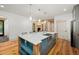 Kitchen island with gray cabinets and a stainless steel sink at 2731 Tribble Mill Rd, Lawrenceville, GA 30045