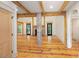 Elegant living room with exposed wood beams, hardwood floors, and a brick fireplace at 2731 Tribble Mill Rd, Lawrenceville, GA 30045