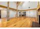 Large living area with hardwood floors, exposed beams, and a fireplace at 2731 Tribble Mill Rd, Lawrenceville, GA 30045