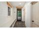 Mudroom with built-in bench, storage, and slate tile flooring at 2731 Tribble Mill Rd, Lawrenceville, GA 30045