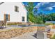 Beautiful backyard pool featuring a stone surround, attached spa, and a lovely water feature at 2731 Tribble Mill Rd, Lawrenceville, GA 30045