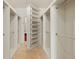 Spacious walk-in closet with built-in shelving and ample storage space for clothes and accessories at 2731 Tribble Mill Rd, Lawrenceville, GA 30045