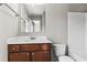 Full bathroom features a wood vanity with a large mirror and a shower-tub combo at 3058 Turman Cir, Decatur, GA 30033