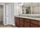 Bathroom with dual sinks, wood cabinets and large mirror at 3058 Turman Cir, Decatur, GA 30033