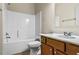 Bathroom featuring white bathtub, toilet, and vanity with dark wood cabinets at 3058 Turman Cir, Decatur, GA 30033