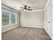 A bright bedroom features neutral paint, carpeted floors, and large windows at 3058 Turman Cir, Decatur, GA 30033