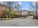 Secured entrance to the community featuring brick pillars, iron gates, and well-maintained landscaping at 3058 Turman Cir, Decatur, GA 30033