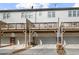 Rear exterior view highlighting decks and garage doors beneath a grey townhouse complex at 3058 Turman Cir, Decatur, GA 30033