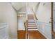 Inviting foyer featuring hardwood floors, a staircase with wooden railing, and decorative wall trim at 3058 Turman Cir, Decatur, GA 30033