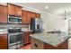 Kitchen with stainless steel appliances, granite countertops and a center island at 3058 Turman Cir, Decatur, GA 30033