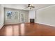 Spacious living room featuring hardwood floors, a fireplace, and plenty of natural light from windows and a door at 3058 Turman Cir, Decatur, GA 30033