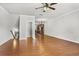 Open-concept living room with hardwood floors that flows into the kitchen, creating an inviting and seamless living space at 3058 Turman Cir, Decatur, GA 30033