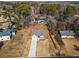 Aerial view of the property showcasing the house, driveway, and surrounding landscape at 45 3Rd E Ave, Dallas, GA 30157