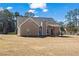 View of home, showcasing a spacious backyard perfect for outdoor activities at 45 3Rd E Ave, Dallas, GA 30157