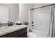 Bathroom featuring granite countertop and a shower-tub combo at 45 3Rd E Ave, Dallas, GA 30157