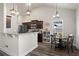 Modern kitchen and breakfast nook featuring stone countertops and stainless steel appliances, perfect for entertaining at 45 3Rd E Ave, Dallas, GA 30157