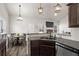 Kitchen view featuring a sink with granite countertops and stainless steel dishwasher at 45 3Rd E Ave, Dallas, GA 30157