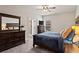 Comfortable main bedroom suite with large bed, dresser and ensuite bathroom at 45 3Rd E Ave, Dallas, GA 30157