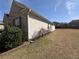Exterior view of home featuring a spacious lawn and privacy fence at 7843 Nolan Trl, Snellville, GA 30039