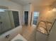 Bright bathroom featuring a tub, shower, and dual vanities at 7843 Nolan Trl, Snellville, GA 30039