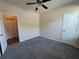 Comfortable bedroom features neutral walls and gray carpet at 7843 Nolan Trl, Snellville, GA 30039