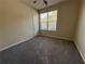 Bright bedroom with large window and cozy carpet at 7843 Nolan Trl, Snellville, GA 30039