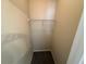 Walk-in closet with rod for hanging clothes, providing ample storage space at 7843 Nolan Trl, Snellville, GA 30039