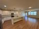 Open floor plan showcases the kitchen, living room and ample natural light from large windows at 7843 Nolan Trl, Snellville, GA 30039