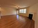 View of the living room with hardwood floors and a fireplace at 7843 Nolan Trl, Snellville, GA 30039