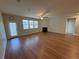 The living room features ample natural light, a ceiling fan and a fireplace at 7843 Nolan Trl, Snellville, GA 30039