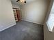 Cozy office space with carpet, ceiling fan, and French doors leading to another room at 7843 Nolan Trl, Snellville, GA 30039