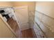 A pantry with white wire shelving and wood flooring at 7843 Nolan Trl, Snellville, GA 30039