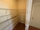 Walk-in pantry with floor-to-ceiling wire shelving for optimal storage at 7843 Nolan Trl, Snellville, GA 30039